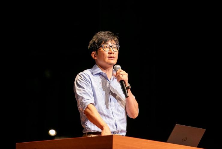写真:先進事例発表のようす2（丸山和彦浦和ひなどり保育園園長）